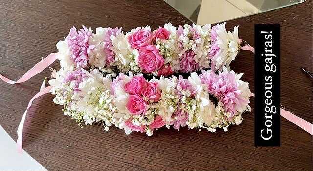 Pink and white floral gajray pair with roses, chrysanthemums, and baby’s breath in Islamabad.