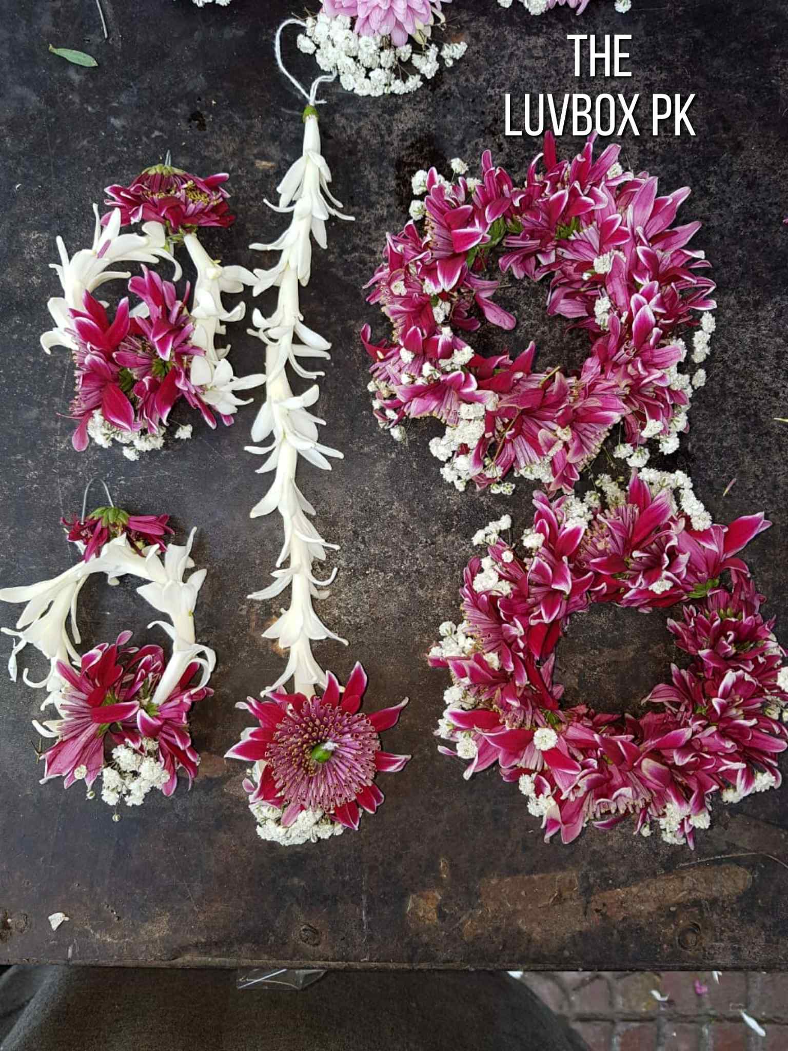Maroon chrysanthemum bridal floral jewelry set with earrings and bindiya for brides in Islamabad.