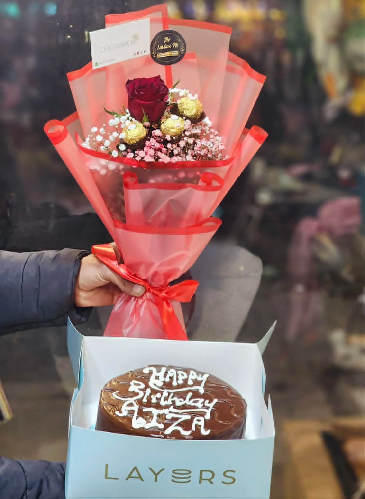 Mini rose and Ferrero bouquet with 2 lbs cake for affordable gifting.
