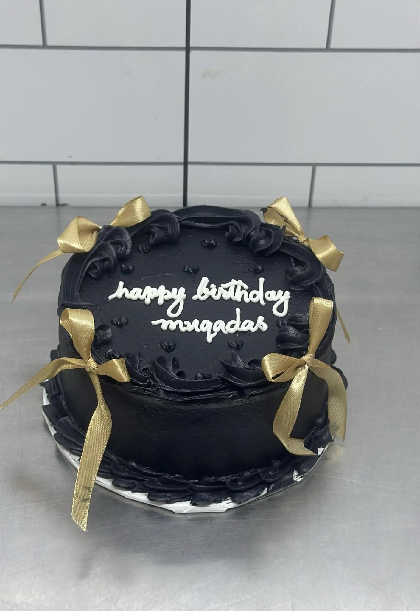Black themed 2 lbs cake with golden bows designed for him.