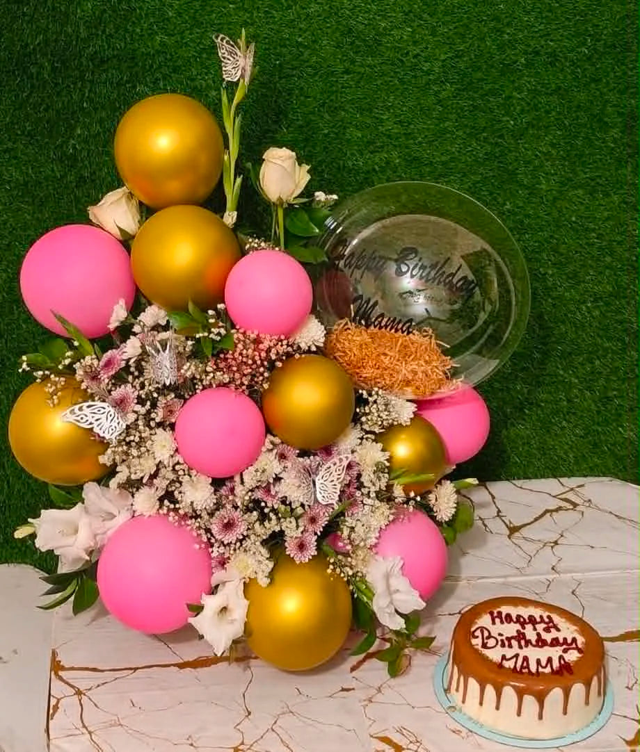 Gorgeous new-shape balloon bouquet filled with fresh flowers and paired with a 2 lbs Lotus cake, designed as a special birthday gift in Islamabad.