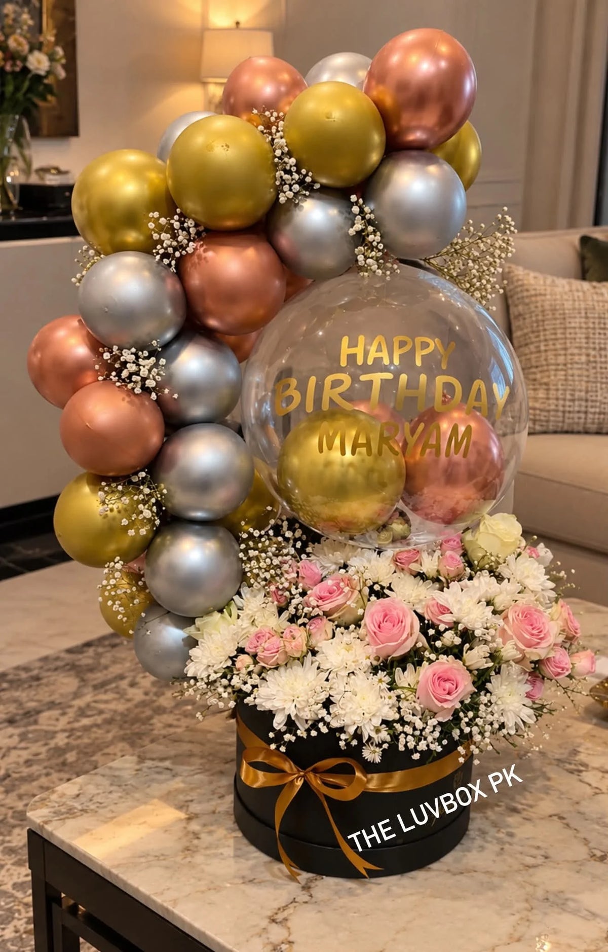 Gorgeous flower gift box with decorative balloon arch and personalized message balloon for birthday and anniversary delivery Pakistan
