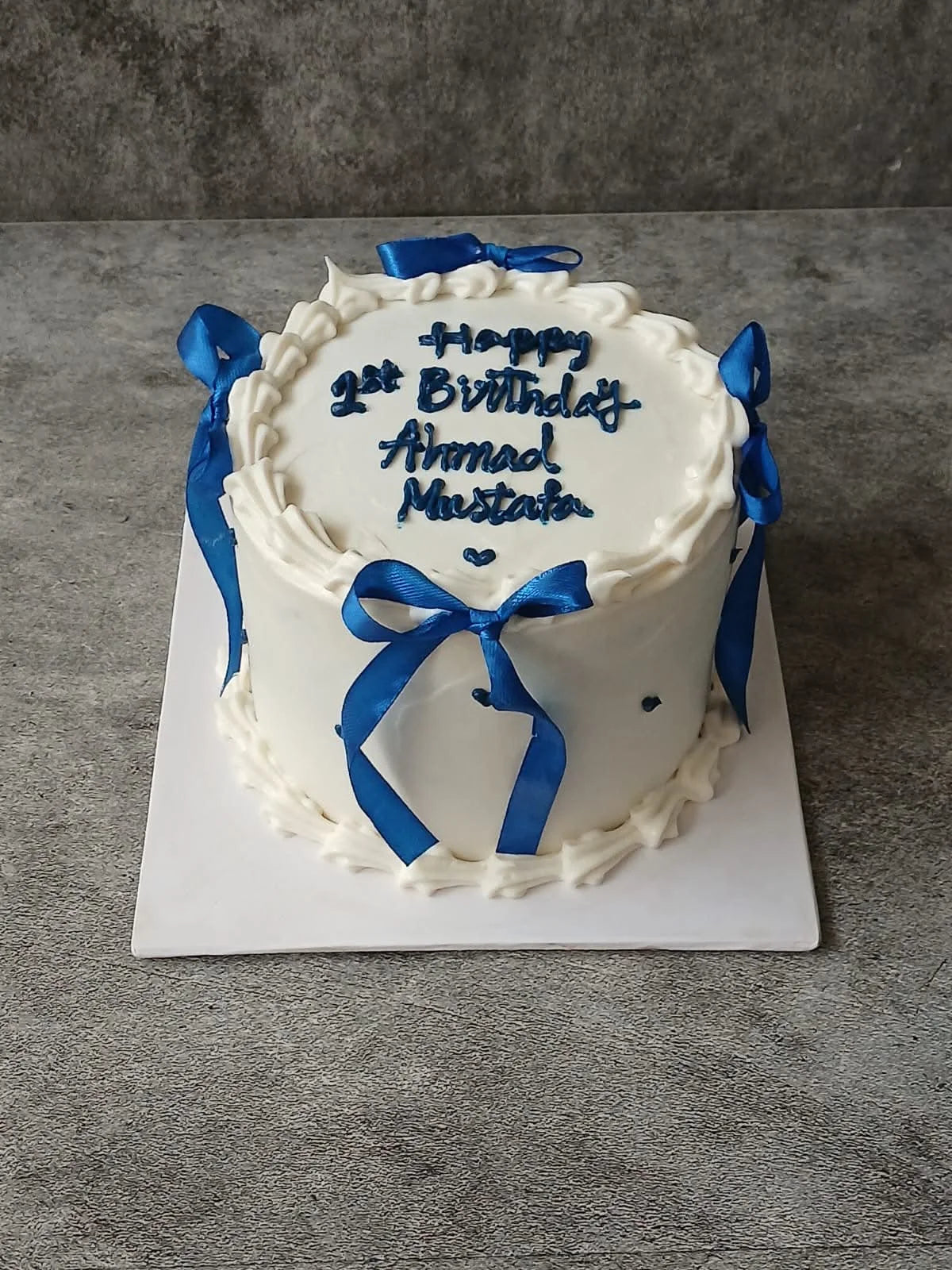 Best-selling 2 lbs white and blue customized birthday cake for him with delivery in Pakistan