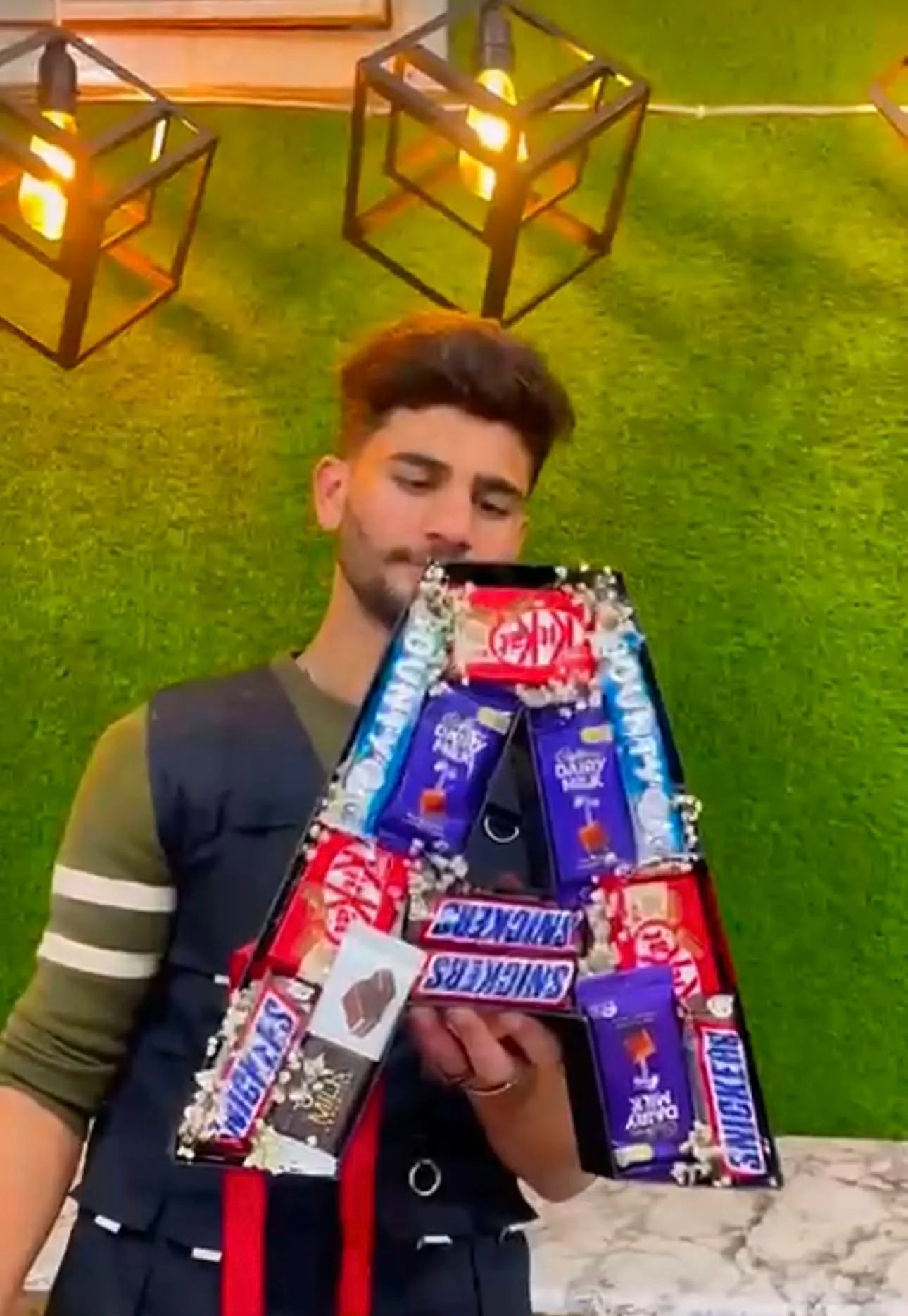 Letter A shaped chocolate box filled with assorted chocolates for gifting.