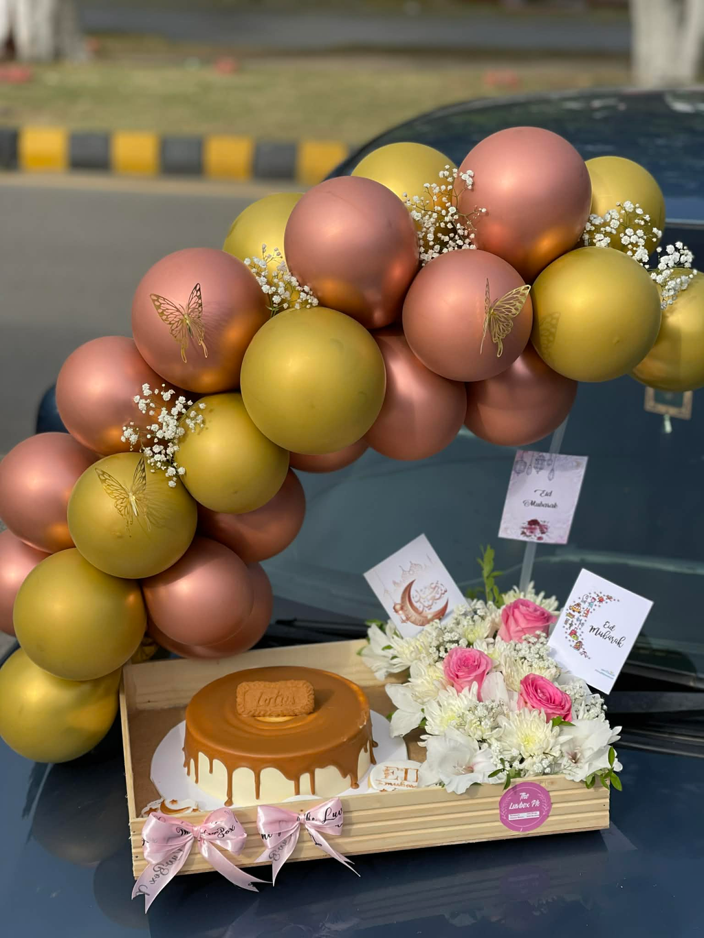 Gorgeous balloon arch wooden tray with Lotus cake for Eid Mubarak
