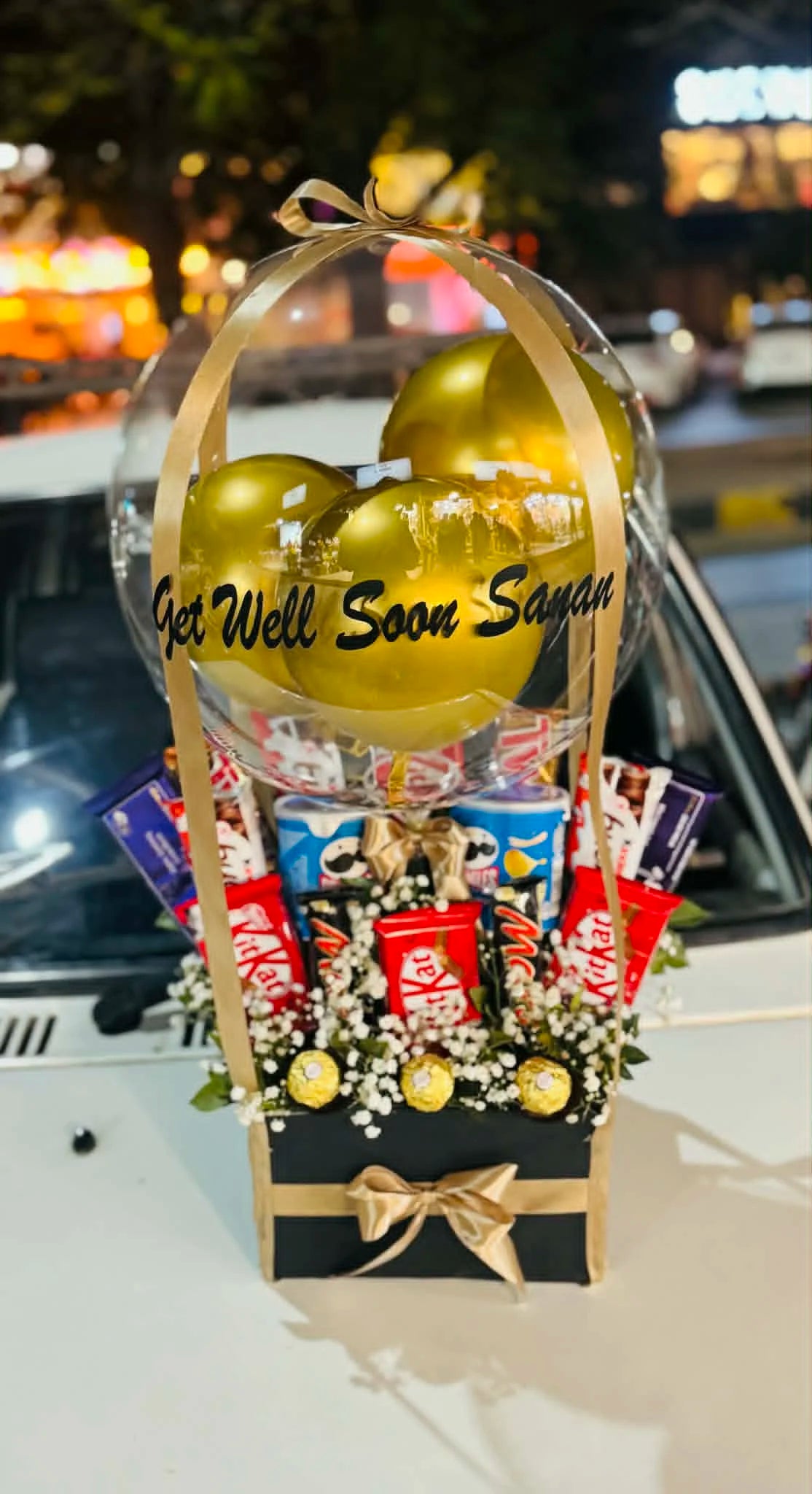 Get well soon balloon box filled with mixed chocolates for recovery gift.