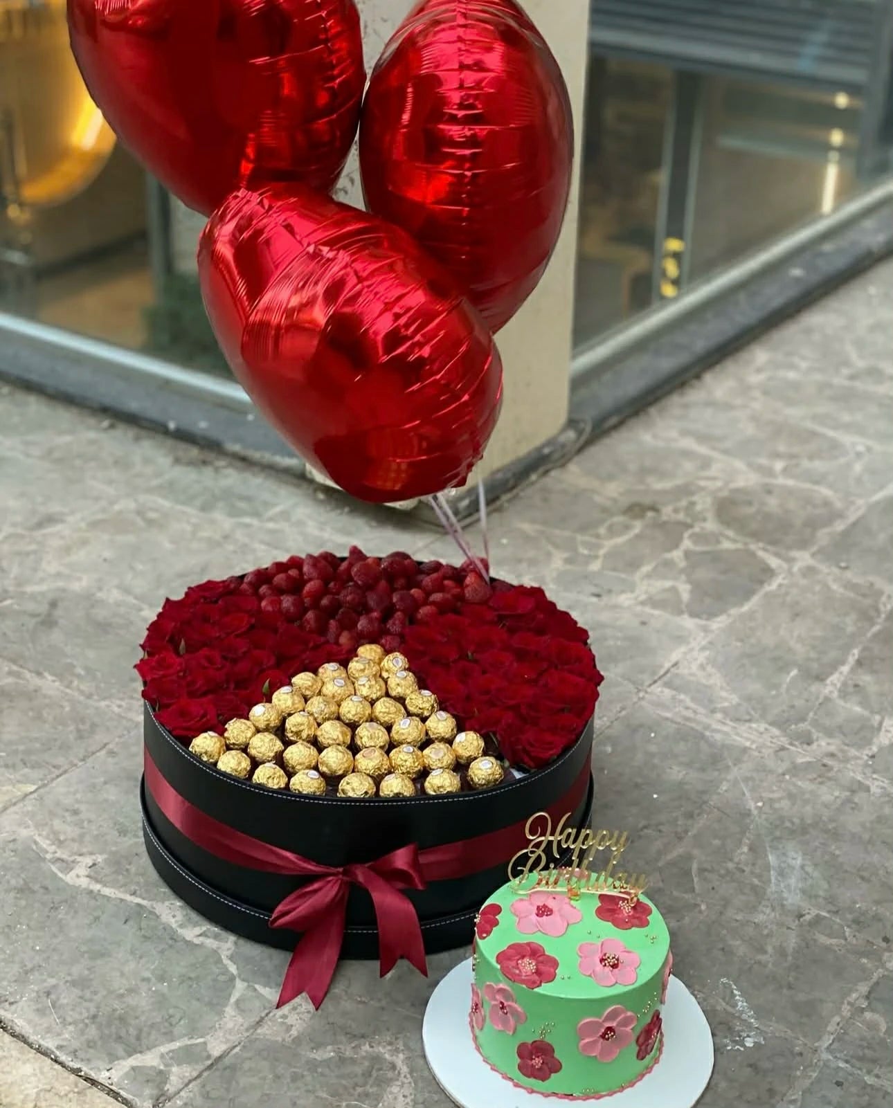 Oversized rose box with ferrero compartment cake and balloons from gift shop Islamabad

