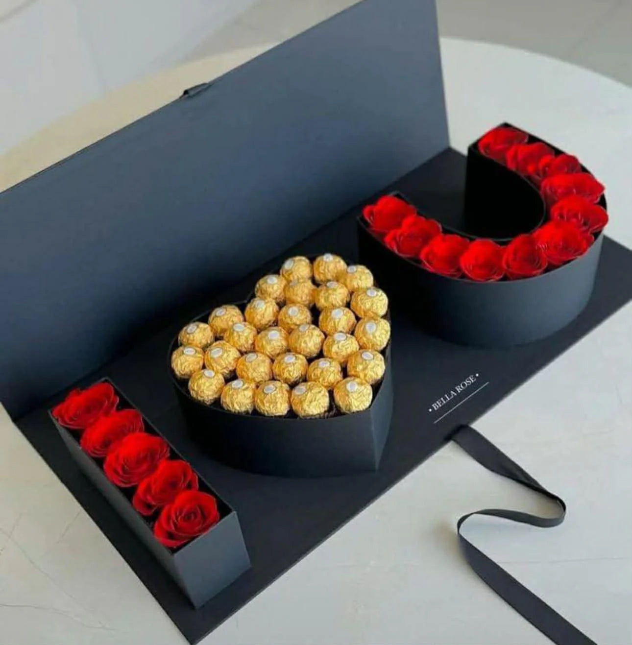 I Love You flap box with roses forming letters and heart filled with Ferrero chocolates.