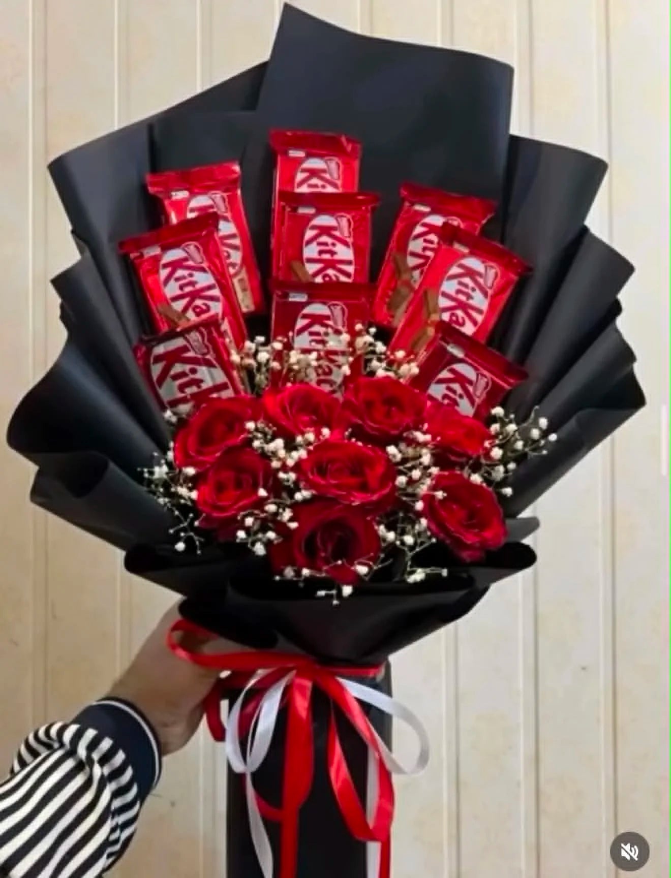 Romantic red-themed KitKat chocolate bouquet beautifully wrapped as an anniversary gift for couples in Islamabad.