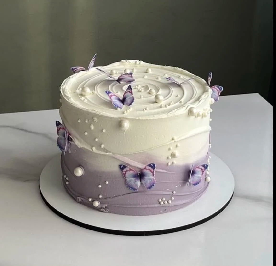 Luxury 2 lbs white and lavender butterfly designer cake for birthdays, bridal showers, anniversaries, and cake delivery in Islamabad.