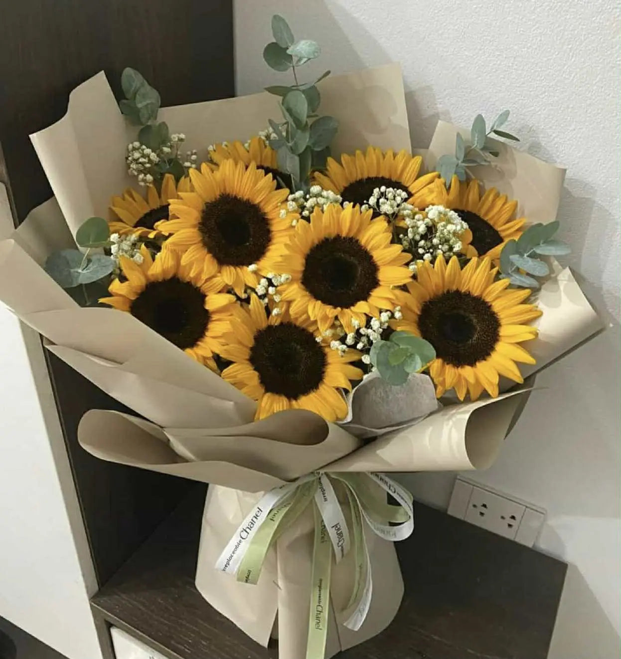 Luxury sunflower bouquet wrapped in elegant brown paper