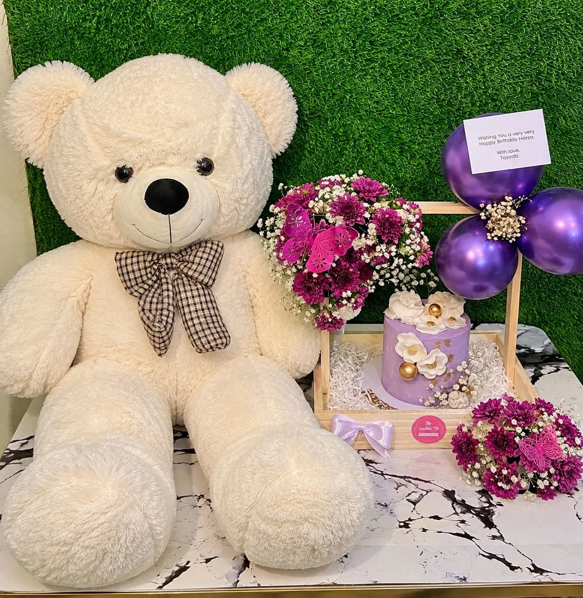 Midnight birthday surprise Islamabad with 3 feet white teddy purple floral wooden tray and 3 lbs custom cake