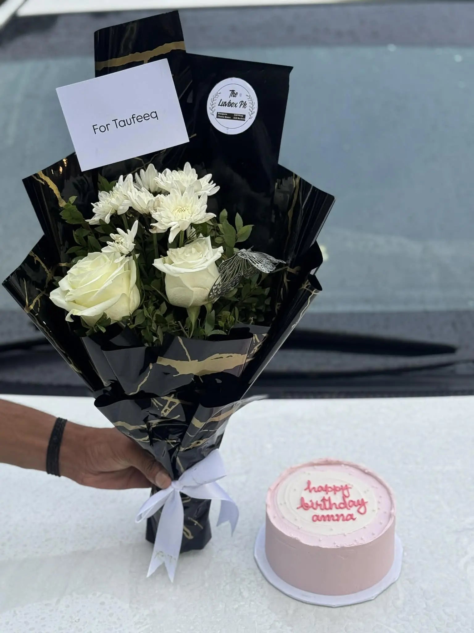 Mini flower bouquet with a bento cake, beautifully arranged for gifting.