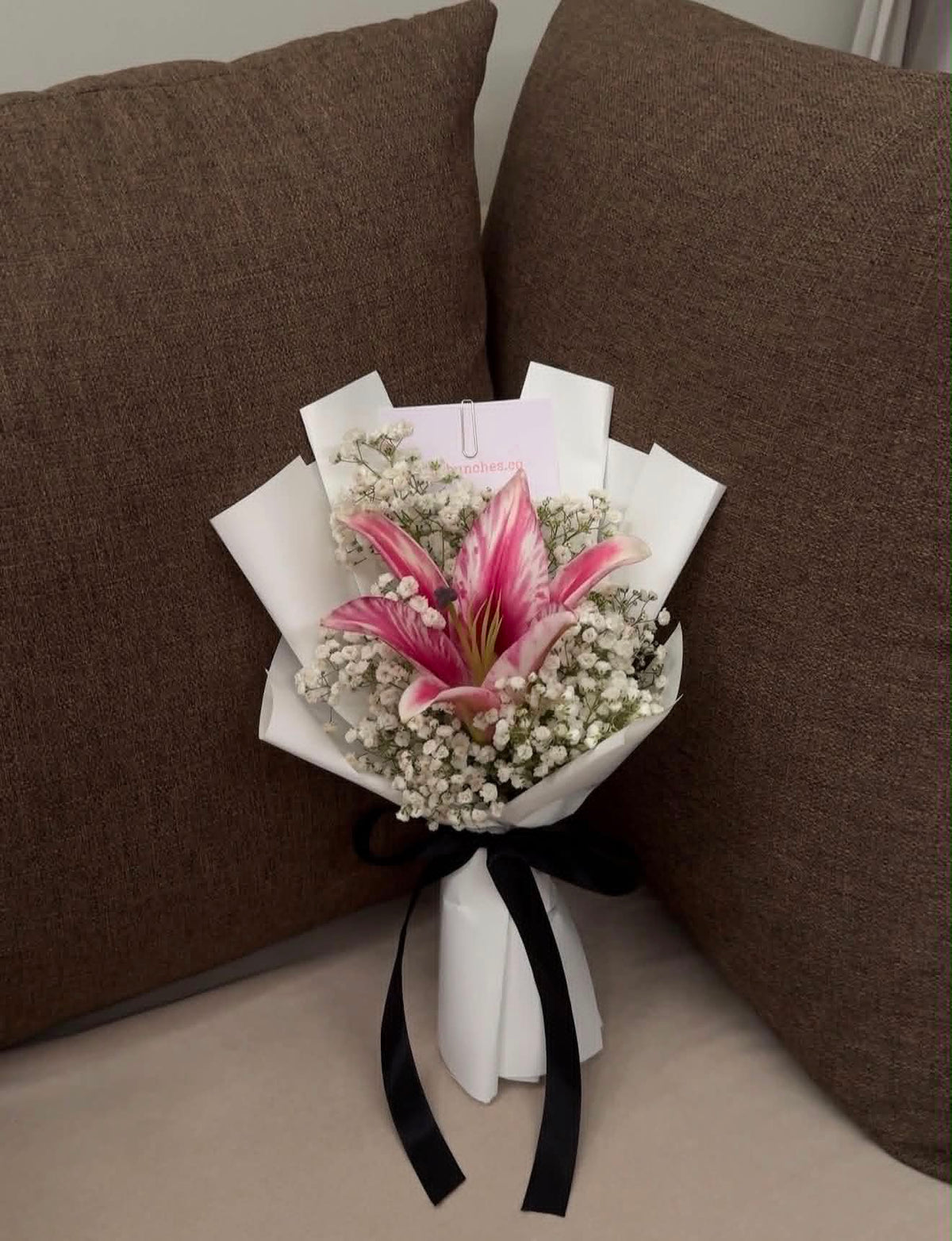 Mini white lily bouquet with delicate Baby’s Breath, elegantly wrapped for flower delivery and gifting in Islamabad.