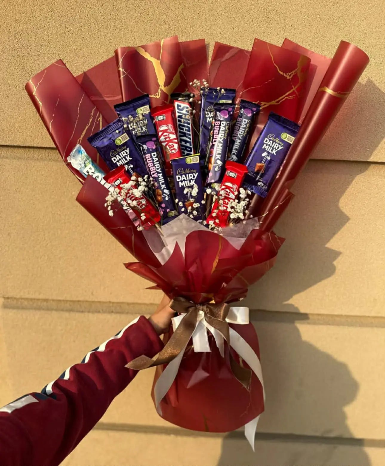 Mixed chocolate bouquet beautifully wrapped for gift delivery in Islamabad for him or her.