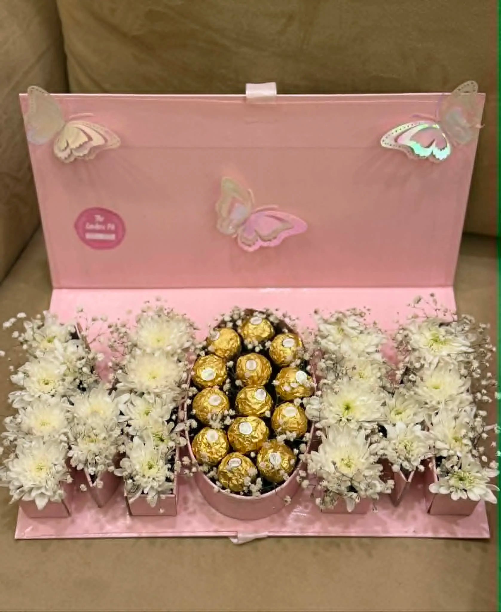 Mother’s Day flap box with MOM message white flowers and Ferrero chocolates Islamabad Pakistan delivery