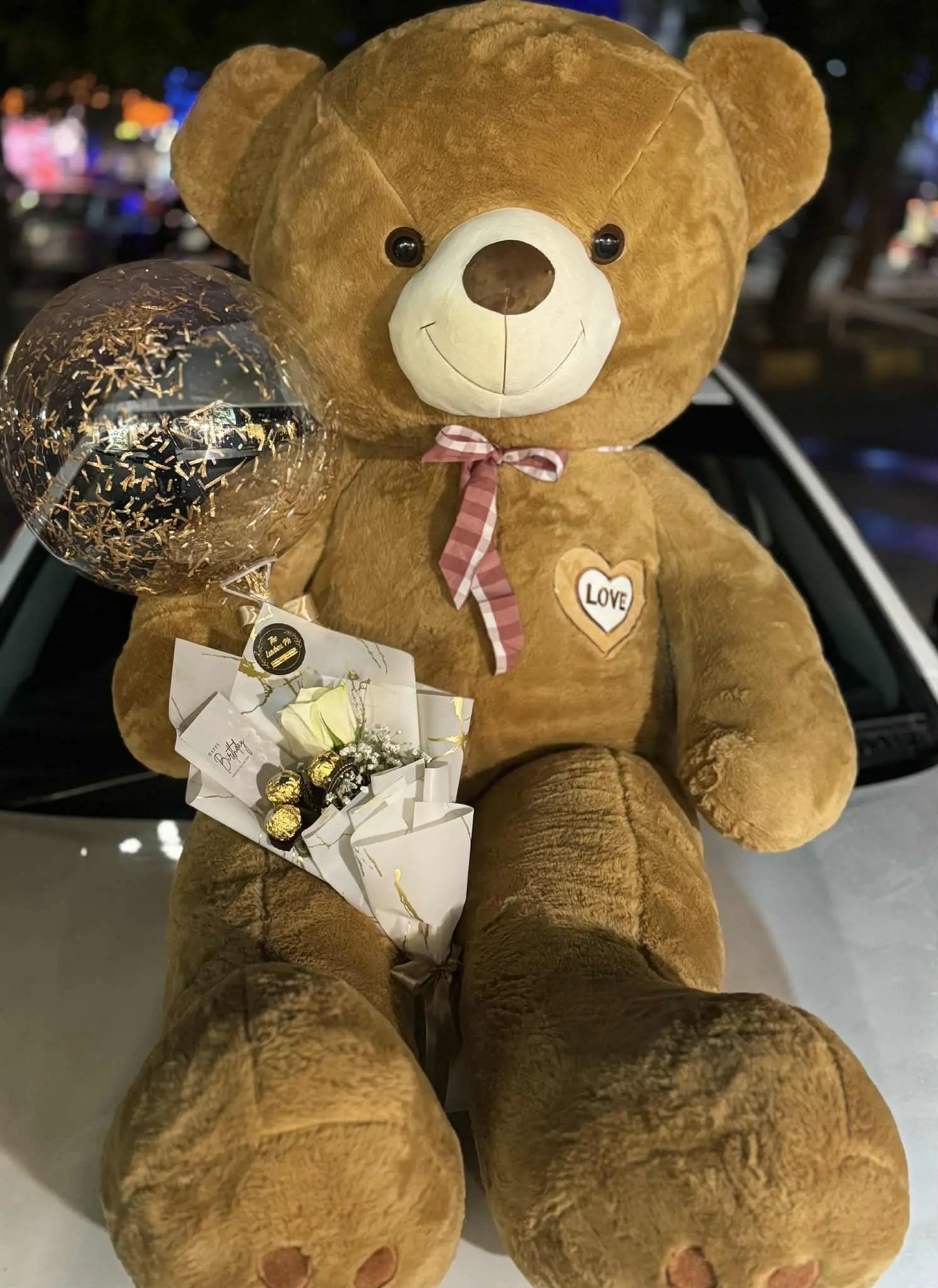 6 feet giant teddy bear gift package with mini rose bouquet, balloon, and Ferrero Rocher chocolates – romantic gift in Islamabad.