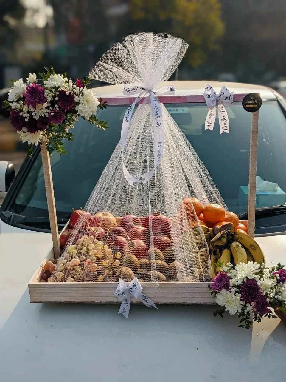 Royal Bloom Harvest – Premium Seasonal Fruit Basket with Floral Decor