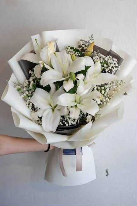 Elegant lilies bouquet wrapped beautifully