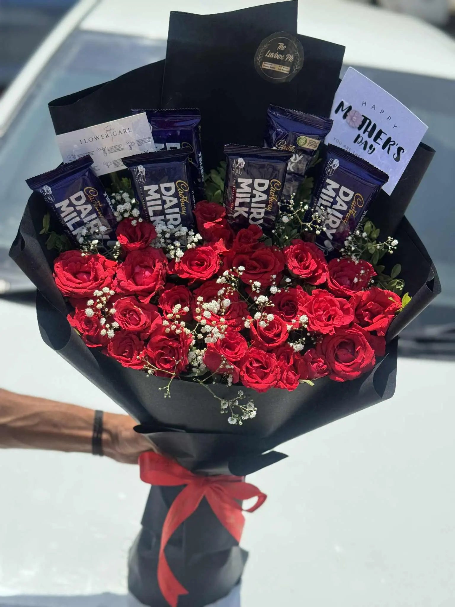 Red roses and Dairy Milk chocolate bouquet wrapped in luxury style