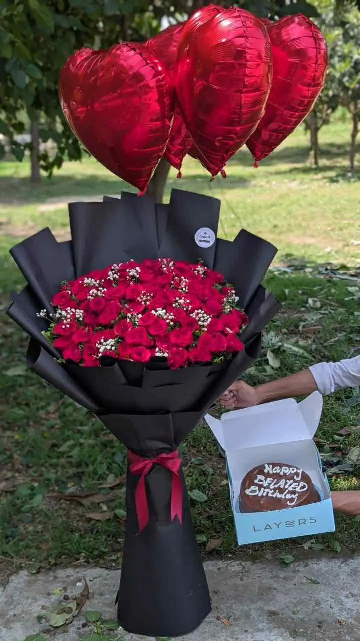 Oversized red rose bouquet with cake and balloons – luxury gift combo from florist in Islamabad