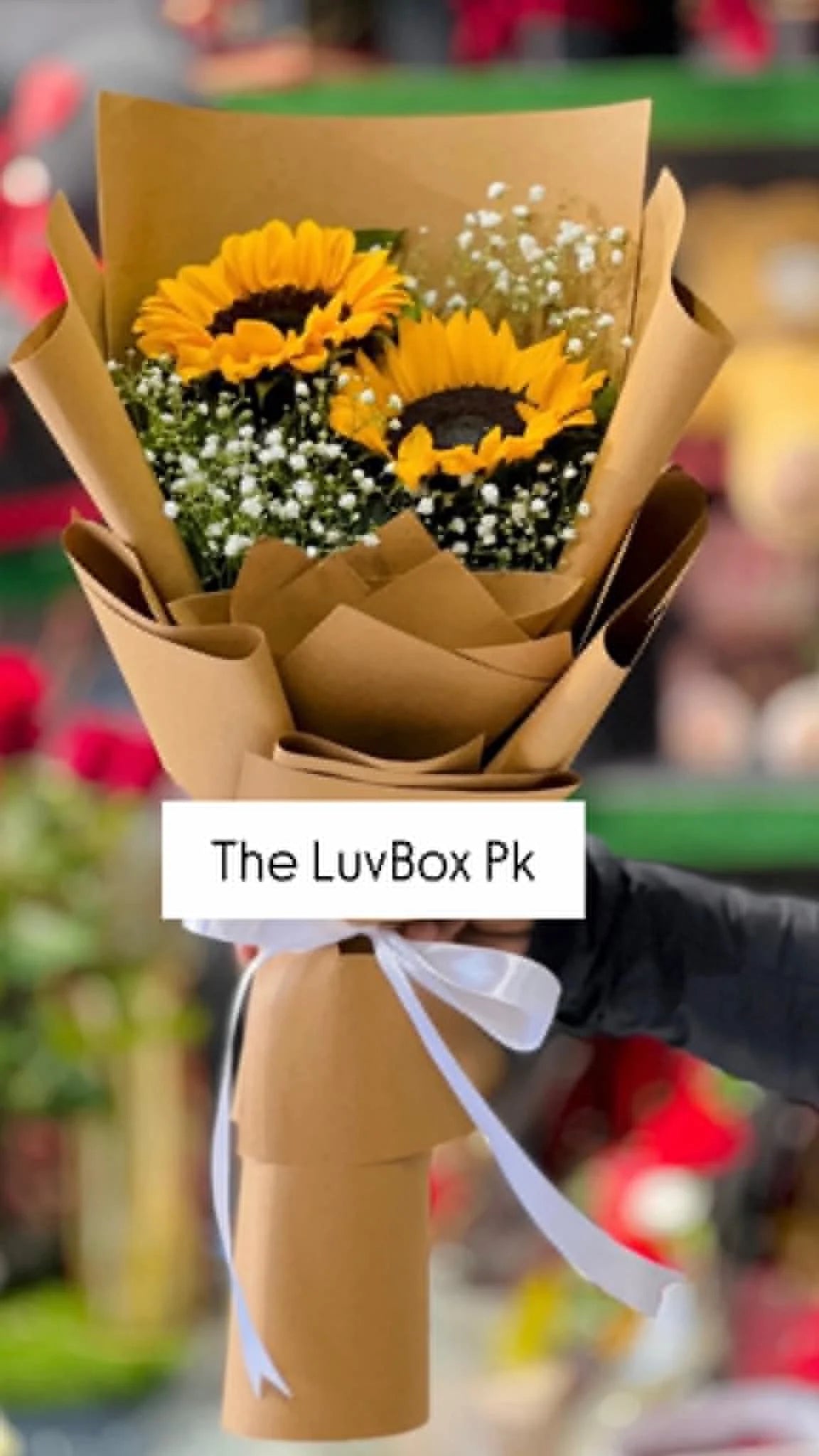 Beautiful mini sunflower bouquet elegantly wrapped in brown paper, perfect for birthdays, congratulations and flower delivery in Islamabad.