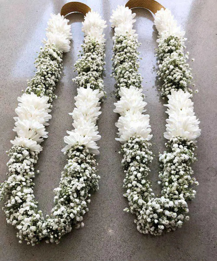 Luxury heavy garland with white chrysanthemums and baby’s breath flowers