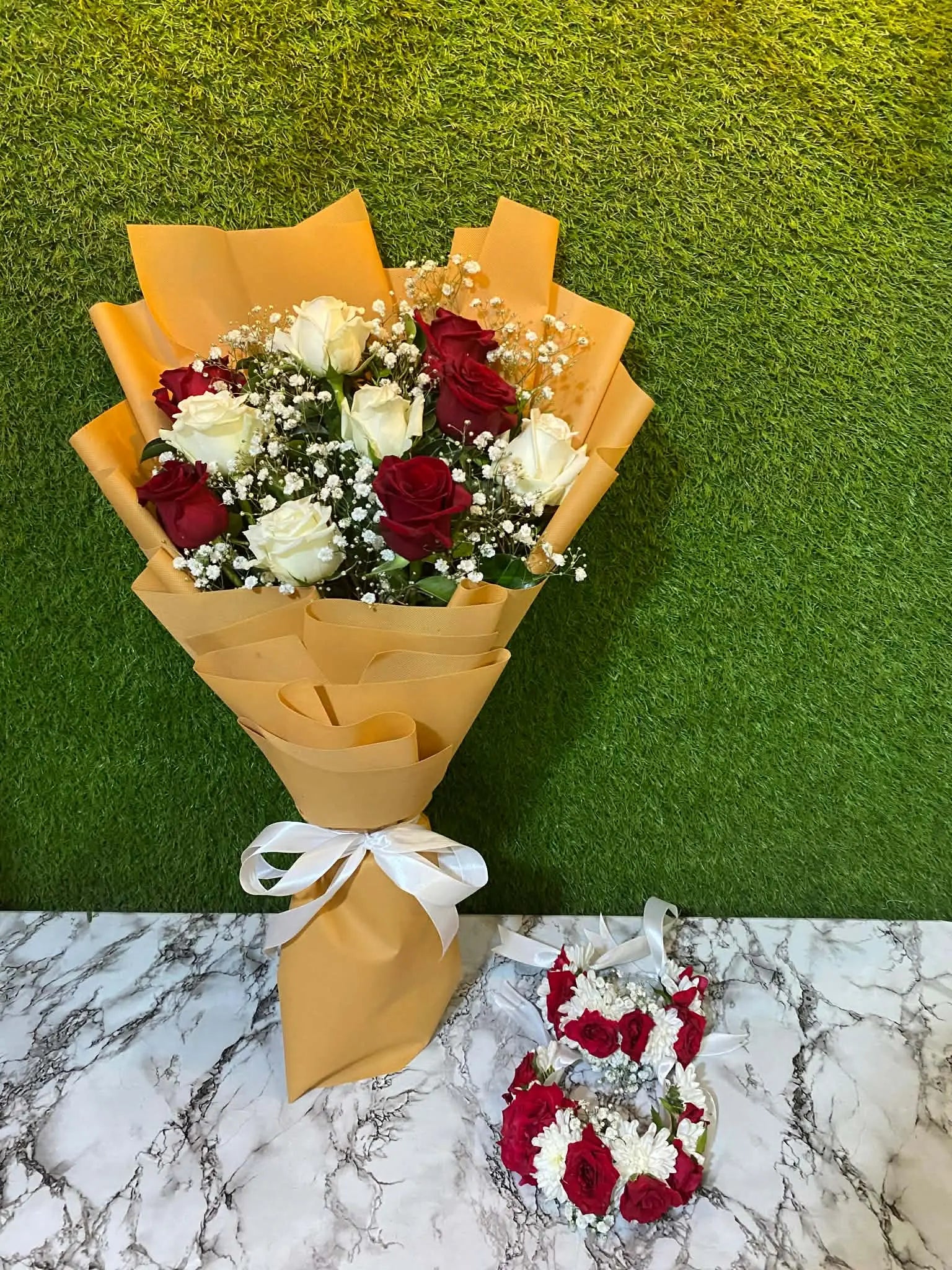 Premium white and red rose bouquet with floral gajray made from chrysanthemums and red roses.